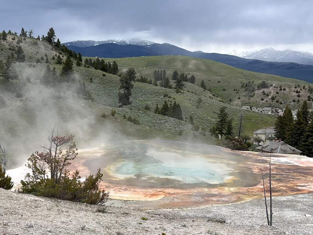 Geothermal hot spring image used to illustrate “ground-source” heat concepts. In inspections, geothermal evaluation centers on indoor equipment, controls, visible piping, and any leakage since loops are buried.
