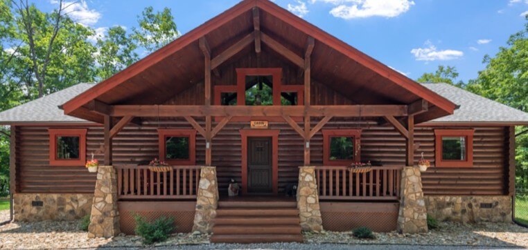 Exterior view of a log home used to illustrate log-specific inspection considerations, including log condition, moisture exposure, settling allowances, corner joinery, and surface finishes. This image supports education around how log and timber homes differ from conventional construction, highlighting why specialized inspection knowledge is required to evaluate material behavior, environmental exposure, and long-term performance in log homes.